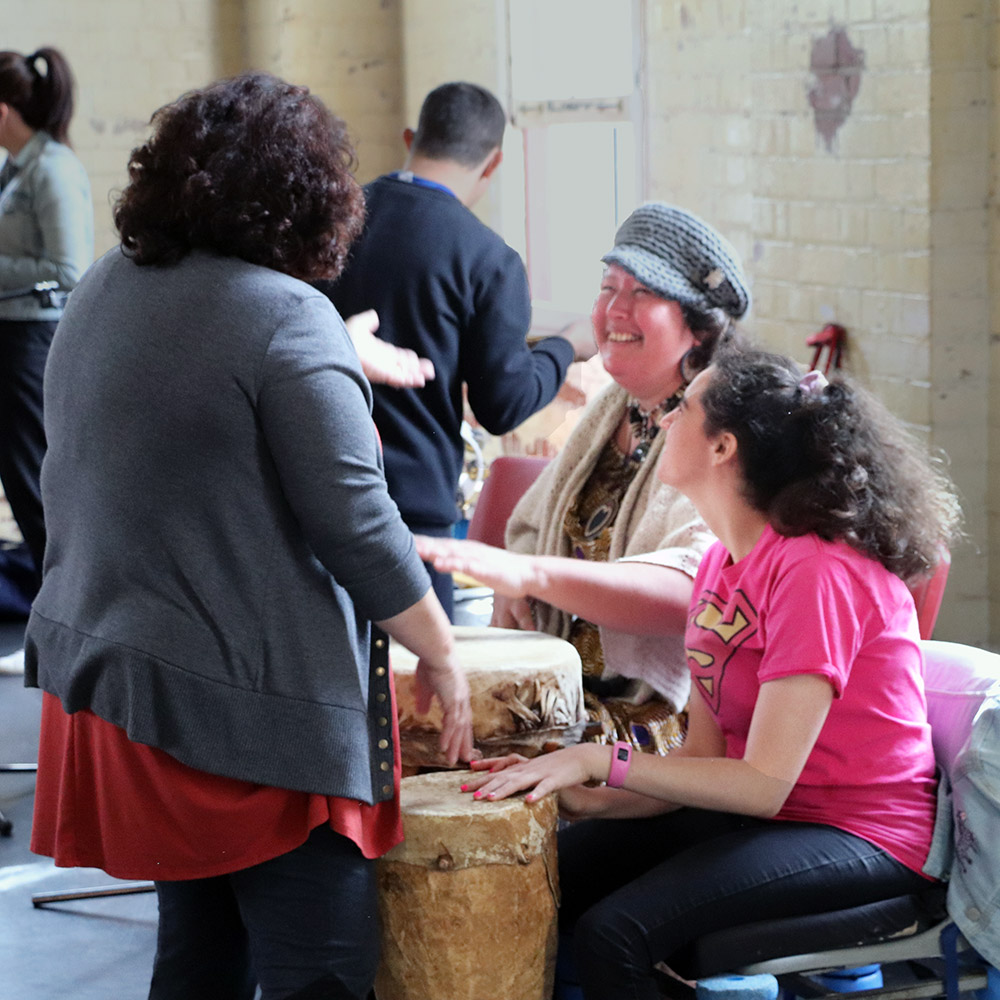 Participants at a drumming workshop in the Brisbane Powerhouse Stores